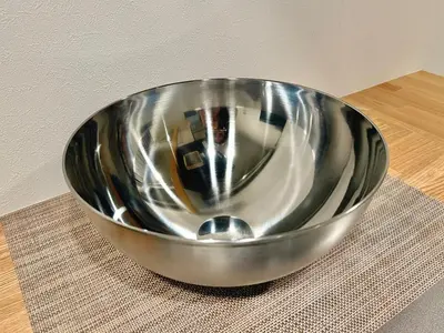 a stainless steel bowl sitting on top of a table at Minami-Magome # 101 in Tokyo
