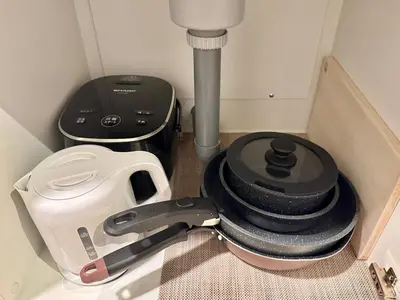 a pile of kitchen tools sitting in a box at Minami-Magome # 101 in Tokyo