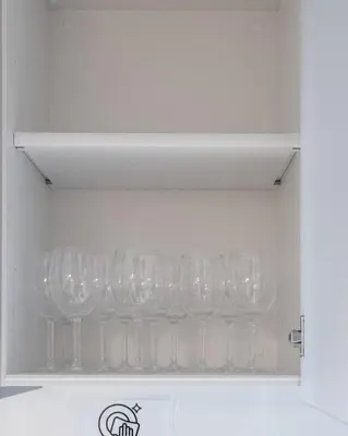 a bunch of wine glasses in a drawer at F&F OMOTESANDO Designer 6LDK near Harajuku&Shibuya in Tokyo