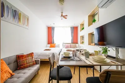 a living room with a couch and a table at Sakura Court Ebisu 105 in Tokyo
