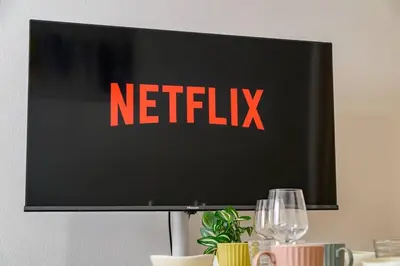 a television screen with a netflix sign on it at Sakura Court Ebisu 105 in Tokyo