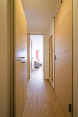 a hallway of an apartment with a long corridor at Sakura Court Ebisu 105 in Tokyo