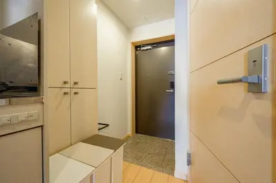 a kitchen with a door leading to a closet at Sakura Court Ebisu 202 in Tokyo