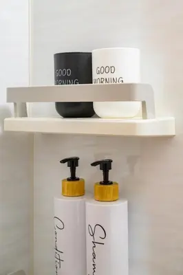 a shelf with two soap dispensers on it at Sakura Court Ebisu 202 in Tokyo