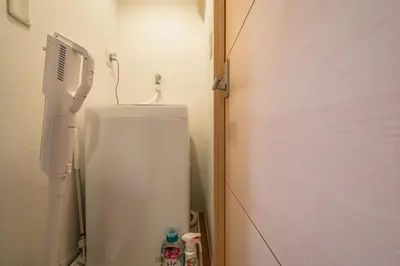 a bathroom with a white toilet in a room at Sakura Court Ebisu 205 in Tokyo