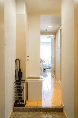 a hallway with white walls and a hallway with a hallway at Sakura Court Ebisu 205 in Tokyo