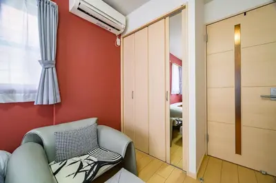 a living room with a couch and a window at Sakura Court Ebisu 205 in Tokyo
