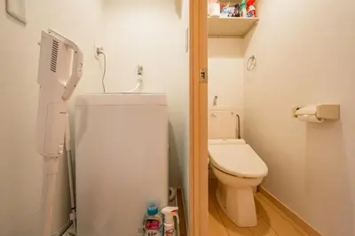 a small bathroom with a toilet and a sink at Sakura Court Ebisu 205 in Tokyo