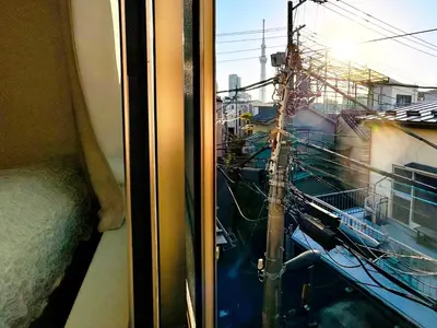 a window with a view of a city at Skytree Detached Home in Tokyo