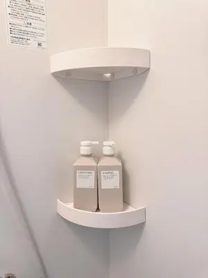 two bottles of medicine on a shelf in a wall at Season Hotel \u65b0\u5c0f\u5ca9 in Tokyo