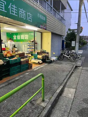 a store with a green railing in front of it at Season Hotel \u65b0\u5c0f\u5ca9 in Tokyo