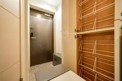 a bathroom with a closet with a door and a door at Sakura Court Ebisu 303 in Tokyo