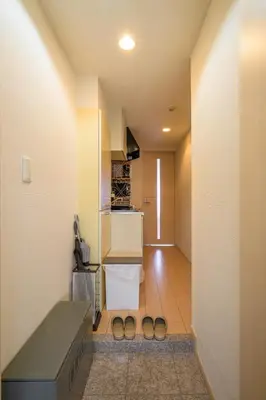 a hallway with two pairs of shoes in a room at Sakura Court Ebisu 303 in Tokyo