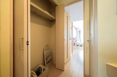 a hallway with a walk in closet with a crib at Sakura Court Ebisu 401 in Tokyo