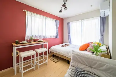 a small bedroom with a bed and a desk at Sakura Court Ebisu 401 in Tokyo