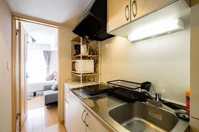 a kitchen with a sink and a counter top at Sakura Court Ebisu 402 in Tokyo