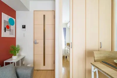 a living room with a sliding door in a room at Sakura Court Ebisu 402 in Tokyo