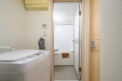 a small bathroom with a sink and a toilet at Sakura Court Ebisu 402 in Tokyo