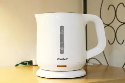 a white slow cooker sitting on top of a table at Sakura Court Ebisu 501 in Tokyo