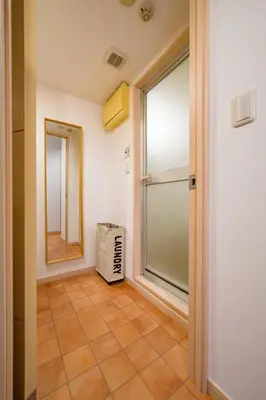 a hallway with a glass door and a window at Sakura Court Ebisu 502 in Tokyo