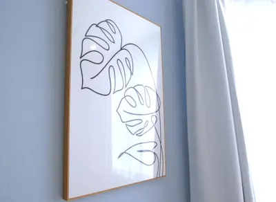 a framed drawing of flowers on a wall at Cassyta Gotanda Zeko-Residence in Tokyo