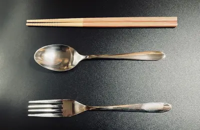 two teaspoons and a fork on a table at Komone House in Tokyo