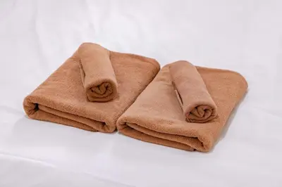 a pair of towels sitting on top of a table at \u4e80\u67095\u4e01\u76ee301 in Tokyo