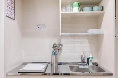 a kitchen counter with a sink in a kitchen at \u4e80\u67095\u4e01\u76ee301 in Tokyo
