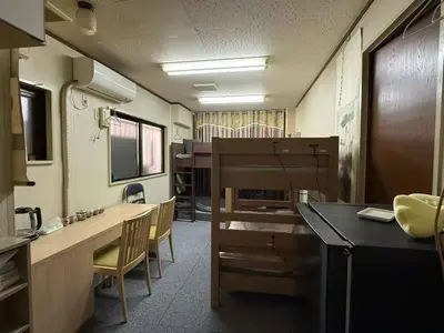 an office with a desk and chairs in a room at \u70df\u96e8\u8f69105 in Tokyo