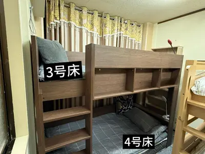 a room with two bunk beds in a room at \u70df\u96e8\u8f69105 in Tokyo
