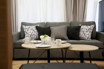 a living room with a couch and a coffee table at Higashi Koiwa 6 Chome House 1F in Tokyo