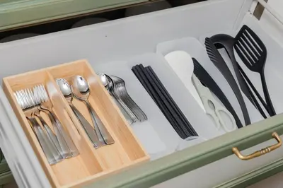a drawer filled with utensils in a kitchen at BF Stay Shinjukugyoen in Tokyo