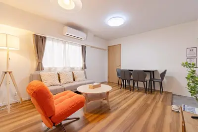 a living room with a couch and a table at \u4e80\u67095\u4e01\u76ee401 in Tokyo