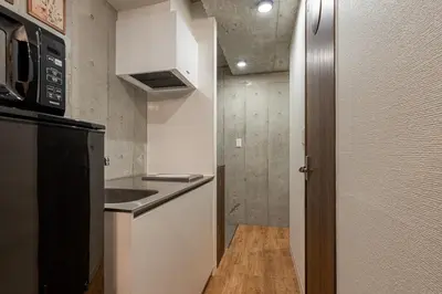 a small kitchen with a sink and a refrigerator at -Centray Okachimachi 102- 1 minute to Akihabara Station and Ueno Station without transfers! in Tokyo