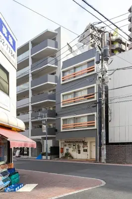 a building on the side of a street at \u4e80\u67095\u4e01\u76ee201 in Tokyo