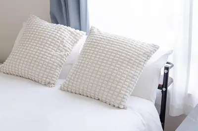 two white pillows on a white bed with a window at \u4e80\u67095\u4e01\u76ee201 in Tokyo