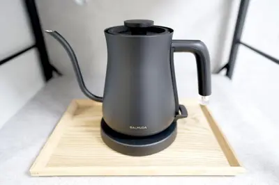a black appliance sitting on a cutting board at 11AM out, Asakusa Base, 3F Skytree-View Rooms, Projector Mini Theater in Tokyo
