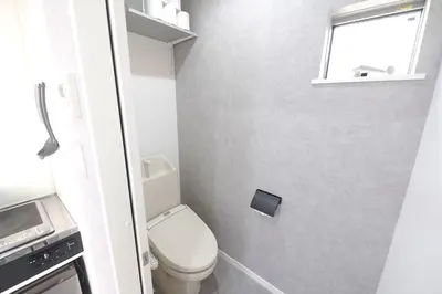 a small bathroom with a toilet and a window at 11AM out, Asakusa Base, 3F Skytree-View Rooms, Projector Mini Theater in Tokyo
