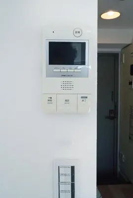 a microwave on a wall in a room at Ikebukuro 303 - Twin Room in Tokyo