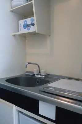 a kitchen with a sink and a counter top at Ikebukuro 303 - Twin Room in Tokyo