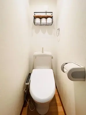 a bathroom with a white toilet and a toilet paper dispenser at Alo BnB 15 - Near TABATA, IKEBUKURO, SHINJUKU, UENO in Tokyo