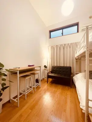 a bedroom with a desk and a bunk bed at Alo BnB 15 - Near TABATA, IKEBUKURO, SHINJUKU, UENO in Tokyo