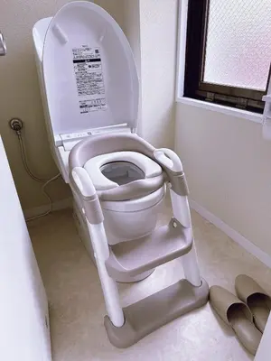 a white toilet with the seat up in a bathroom at Hotel Lien Tokyo2 in Tokyo
