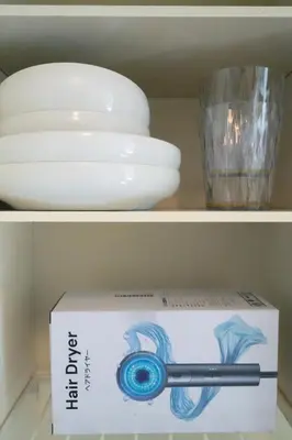 a white bowl and a box on a shelf at Ikebukuro 304 - Twin Room in Tokyo