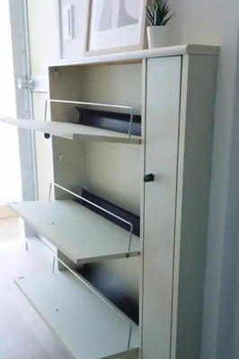 a white cabinet with empty shelves in a room at Ikebukuro 304 - Twin Room in Tokyo