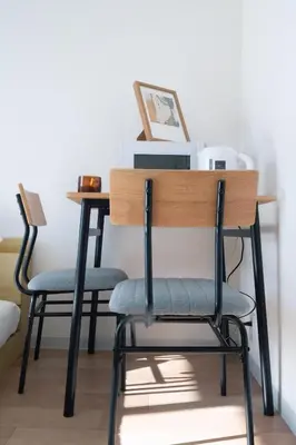 a desk with two chairs and a printer at Ikebukuro 304 - Twin Room in Tokyo