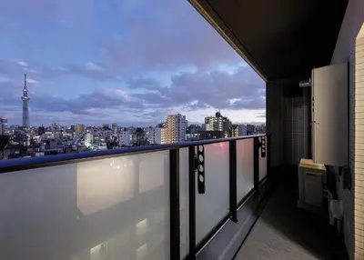 a balcony with a view of a city at ROLES Ryusen 901 in Tokyo