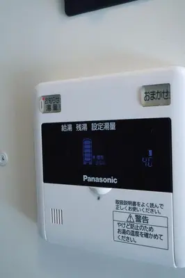 a white electronic device sitting on a table at Ikebukuro 311 - Twin Room in Tokyo