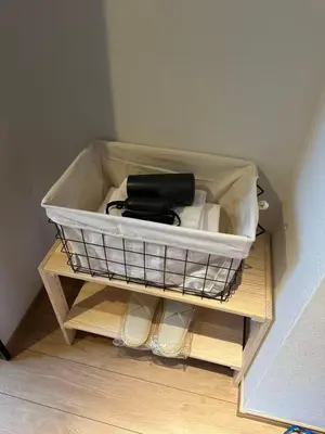 a wire basket on a shelf in a room at Komorebi Rill Hotel HANA in Tokyo