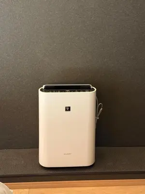 a white toaster sitting on top of a table at Komorebi Rill Hotel HANA in Tokyo